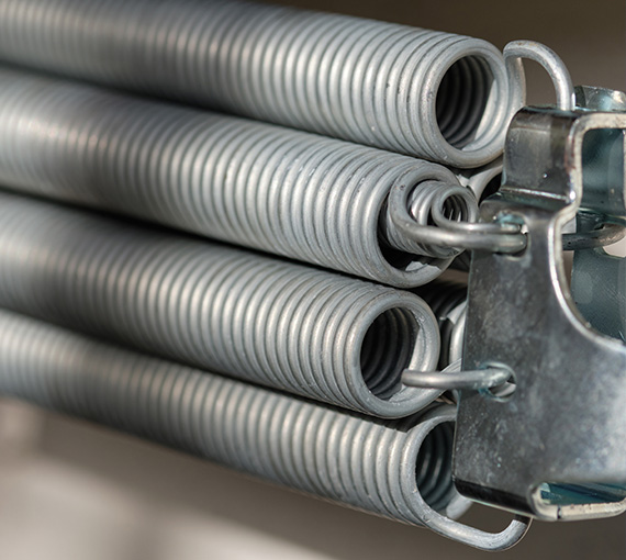 coiled metal springs close up eight tension springs and mechanisms