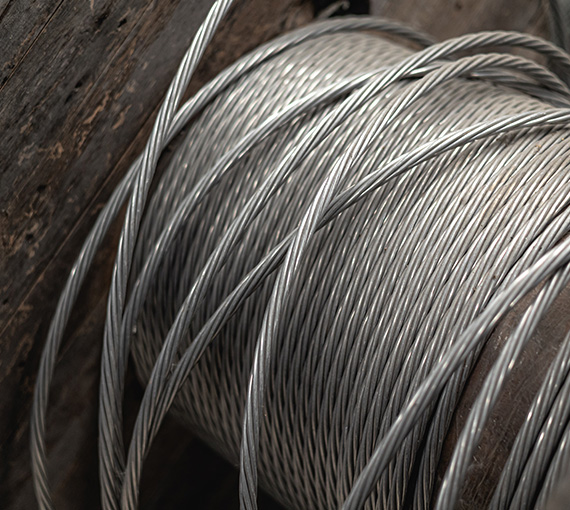 close-up of metal wire coil on wood background strong durable wire construction