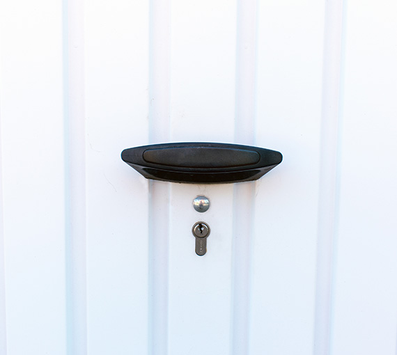 black door handle with a keyhole on a white door surface suitable for entry and security purposes four locking mechanisms