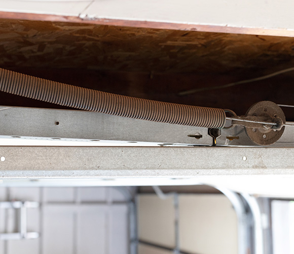 garage door spring mechanism with a metal track for smooth operation providing support for garage doors typically needing maintenance for optimal performance 6 components involved