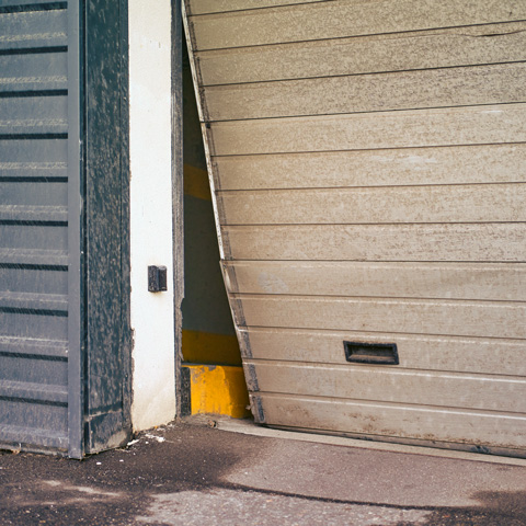 garage door repair company in Suffolk and Bishop's Stortford broken garage door off the hinge